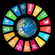 The earth with the multi-colored images from the SDGs in a circle around it.