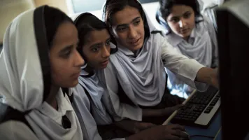 Students working on educational programs in Rawalpindi, Pakistan.