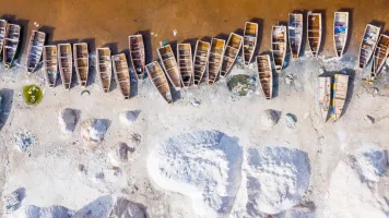 Boats docked on a beach